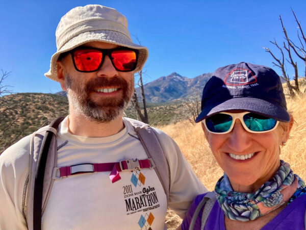 Kathleen Bober and Alastair Laing hiking on the AZT in the Santa Rita Mountains